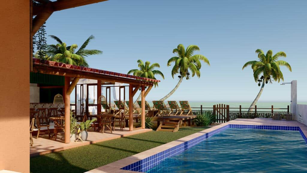 Área externa da Pousada Rota Ecológica, em Alagoas, com piscina e, no lado esquerdo, há uma área gourmet com bancos, mesas, cadeiras e espreguiçadeiras com vista e acesso para o mar